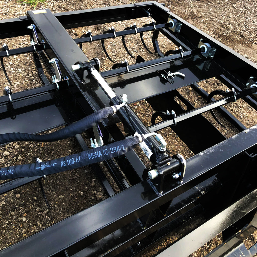 Accumulator grabbing six small square bales for fast field collection.